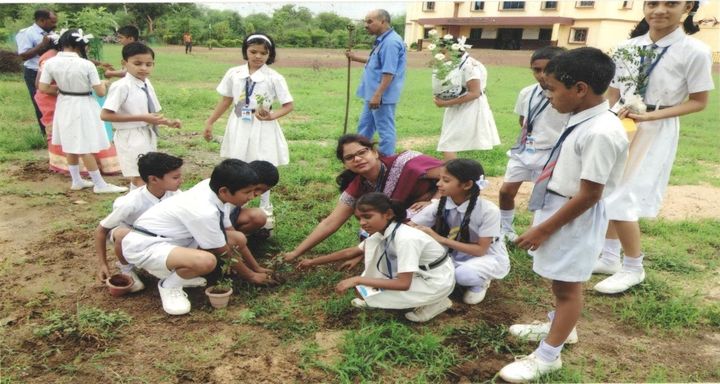 Eco club students planting saplings