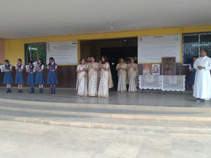 Students and teachers at a school programme