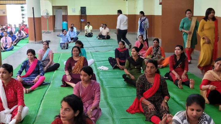 Teachers practising yoga
